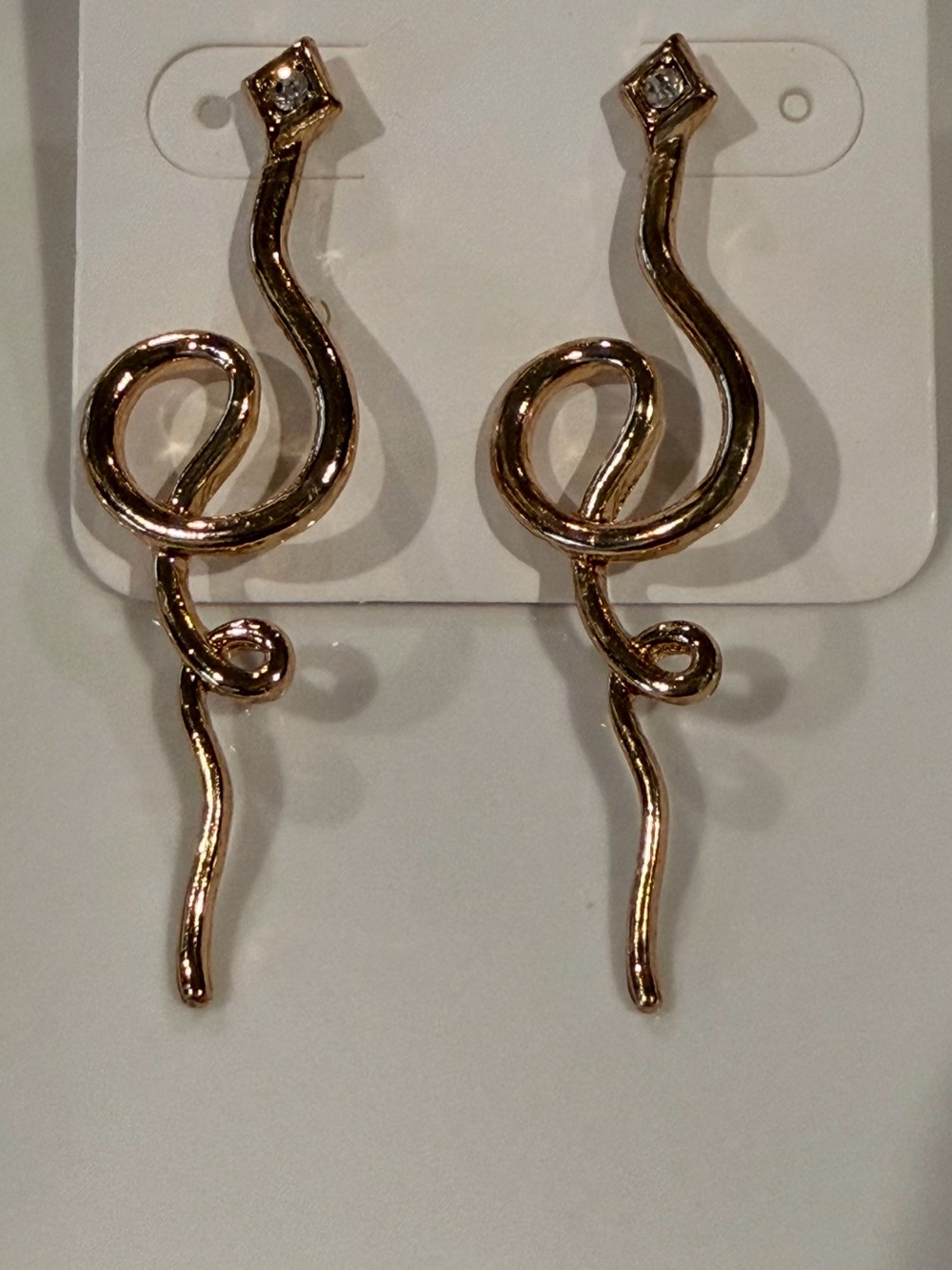 Gold tone dangle earrings